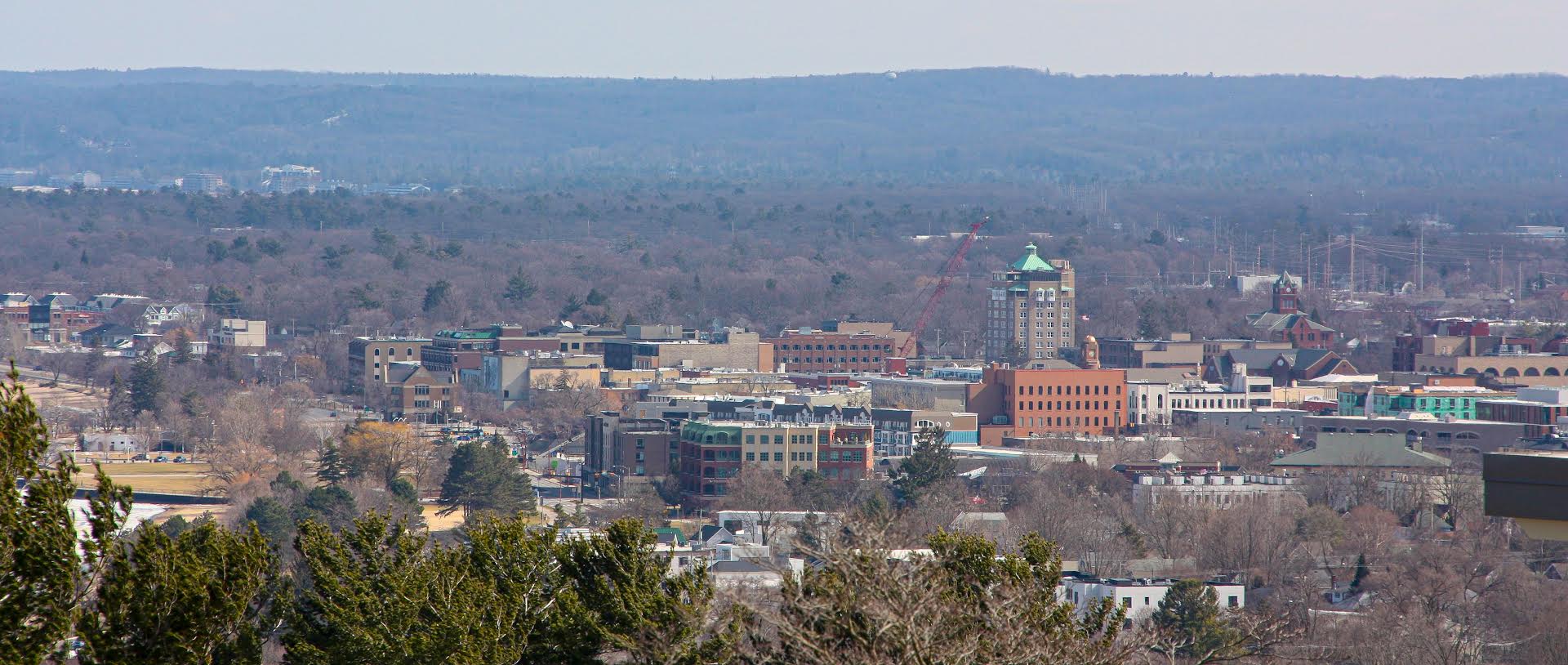 Traverse City, Michigan, viewed from Old Mission Peninsula — the epicentre of the modern Michigan Dogman legend, where radio DJ Steve Cook's 1987 song triggered an unprecedented outpouring of witness reports