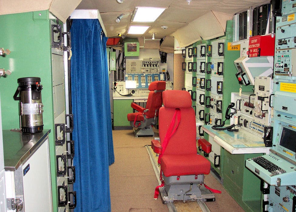 Interior of a Minuteman missile Launch Control Center capsule showing crew consoles and equipment