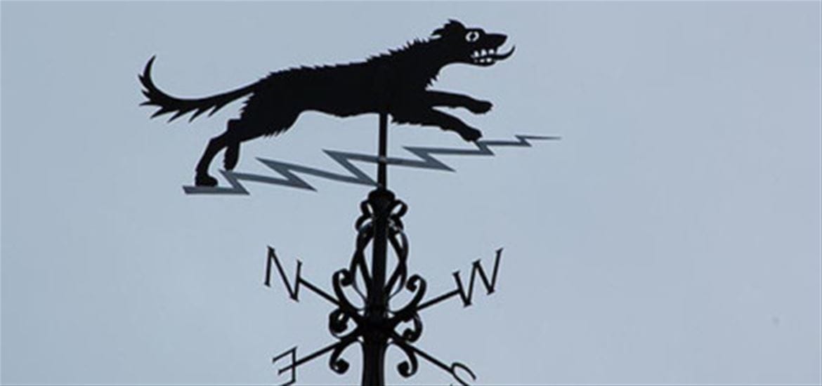The Black Dog of Bungay weathervane, Suffolk — the creature appears on the town's coat of arms, weathervane and public buildings, incorporated into civic identity four and a half centuries after the 1577 incident